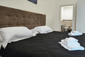 A bed or beds in a room at Home De Curtis