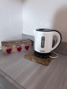 a coffee pot sitting on top of a counter at Casa Vacanze Happy Home in Zafferana Etnea