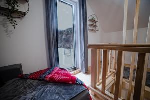 Katil atau katil-katil dalam bilik di Apartman Matija, Mokra Gora
