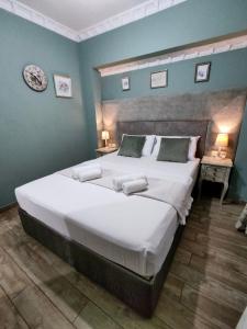 A bed or beds in a room at Green House Skiathos
