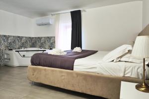 A bed or beds in a room at Home De Curtis