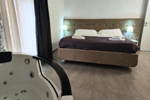 A bed or beds in a room at Home De Curtis