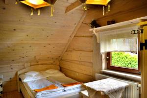 Giường trong phòng chung tại Alpejskie Domy Ski House