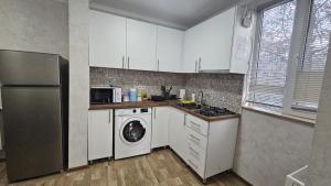 Kuchyň nebo kuchyňský kout v ubytování Apartment Oxalis