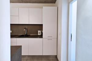 A kitchen or kitchenette at Home De Curtis