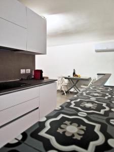 A kitchen or kitchenette at Home De Curtis