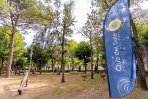 a sign for a playground in a park at Club del Sole Viareggio Family Collection in Torre del Lago Puccini