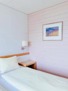 Postel nebo postele na pokoji v ubytování Hotel Gletscherblick