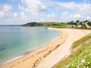 a view of a beach with people on it at The Observatory Tower in Falmouth