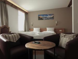 Postel nebo postele na pokoji v ubytování Hotel Spöl Restaurant