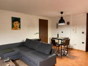 a living room with a couch and a table at SambaSS Aparthotel in San Prisco