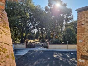 a view of a park with a gate and trees at gite fatima in Théza