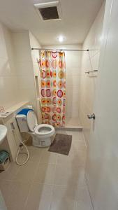 a bathroom with a toilet and a shower at Peaceful Stay at MT Khlong Luang Self-Check-in in Khlong Luang +38 photos