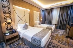 Postel nebo postele na pokoji v ubytování Mirnian Hotel