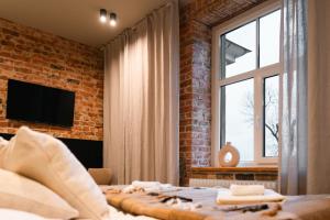 TV a/nebo společenská místnost v ubytování Kaķītis hotel & spa + 37 fotografií