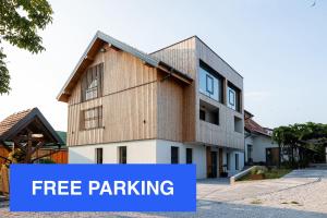 a building with the words free parking with the words free parking at Hotel Frost in Maribor