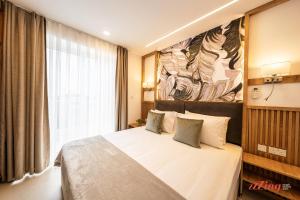 En eller flere senge i et værelse på El Doris Boutique Living St Julian's