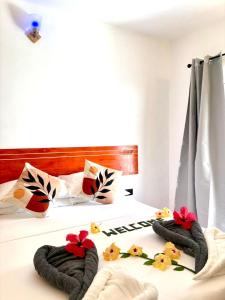 Postel nebo postele na pokoji v ubytování Thoddoo Cozy Stay