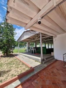 a pavilion with awning and tables on a patio at Flat Cavalinho Branco apt 610 in Águas de Lindóia