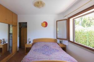 Postel nebo postele na pokoji v ubytování Villino Michela - HelloElba