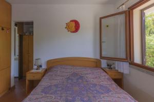 Postel nebo postele na pokoji v ubytování Villino Michela - HelloElba