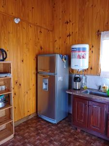 Kuchyň nebo kuchyňský kout v ubytování Cabaña Los Lapachos