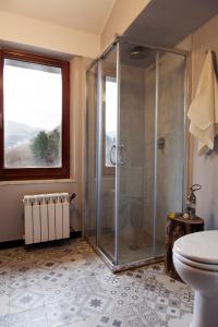 a bathroom with a shower and a toilet at Ca'Luni in Casola in Lunigiana +41 photos