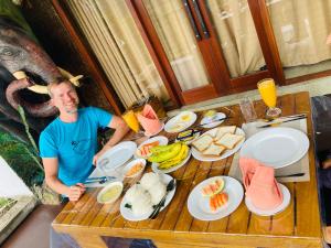a man standing in front of a table full of food at Vibe Ella in Ella +33 photos