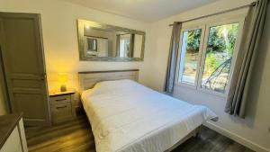 Postel nebo postele na pokoji v ubytování Appartement Cala Di Mare L'ILE ROUSSE