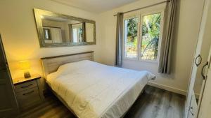 Postel nebo postele na pokoji v ubytování Appartement Cala Di Mare L'ILE ROUSSE