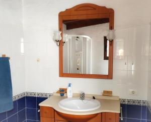 a bathroom with a sink and a mirror at La casa de La Cartita in Puntagorda +36 photos
