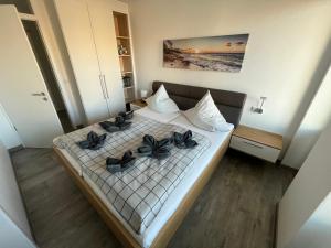 Postel nebo postele na pokoji v ubytování Apartment Sonnenschein, Am Alten Deich 4-6, Whg 1 13