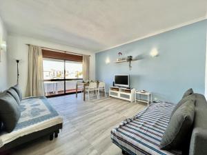 a living room with a couch and a table at Albufeira Classic 2 by Homing in Albufeira