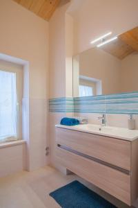 a bathroom with a sink and a mirror at La Casa di Vina in Fermo +53 photos