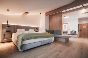 Łóżko lub łóżka w pokoju w obiekcie Ferienwelt Kesselgrub Hotel in Altenmarkt-Zauchensee