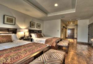 a hotel room with three beds and avisor at Sundance Club Resort in Gordon +20 photos