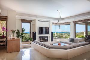 A television and/or entertainment centre at Villa Anastasia - Private Pool & Panoramic Views