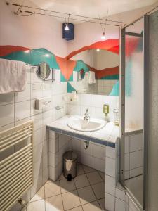 a bathroom with a sink and a mirror at Hotel Gabriela INKLUSIVE SUPER SOMMER CARD in Serfaus +73 photos