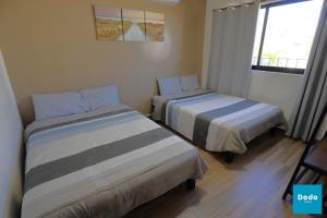 Postel nebo postele na pokoji v ubytování Residencial privado con alberca