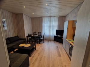 a living room with a couch and a table at Weingut Haxel in Cochem