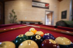 a group of billiard balls on a pool table at Love Shack in Sevierville