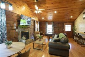 a living room with a couch and a fireplace at Love Shack in Sevierville +15 photos