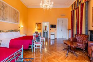 Voodi või voodid majutusasutuse Hotel Principi D'Acaja toas