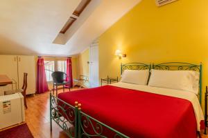 Postel nebo postele na pokoji v ubytování Hotel Principi D'Acaja