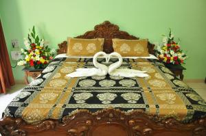 En eller flere senge i et værelse på Villa Theresa Beach Resort