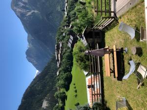 a view of a hill with a house on it at Chalet Juliette in Champagny-en-Vanoise