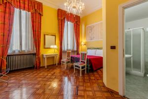 Voodi või voodid majutusasutuse Hotel Principi D'Acaja toas