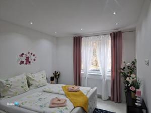 Postel nebo postele na pokoji v ubytování Deea Apartment