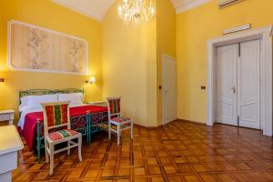Voodi või voodid majutusasutuse Hotel Principi D'Acaja toas