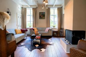 TV a/nebo společenská místnost v ubytování B&B Het Wellnest